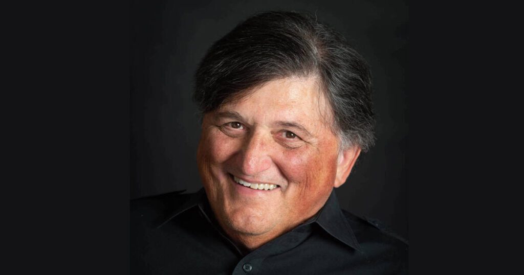 Paul Geist, music industry expert and founder of Hypebot, smiles in this professional headshot, highlighting his influence on music marketing, industry insights, and digital trends for artists and brands.